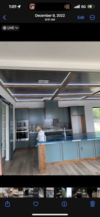 a photo of a kitchen with blue cabinets