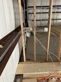 the ceiling of a building is being constructed with wires